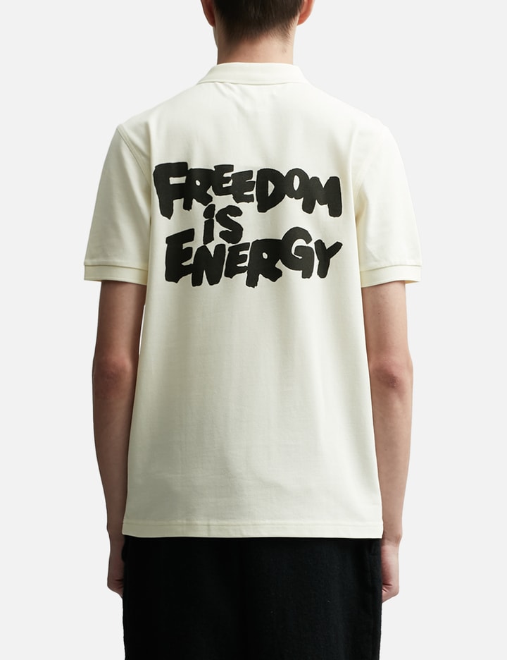 CDG SHIRT X FRED PERRY SS POLO W "FREEDOM IS ENERGY"